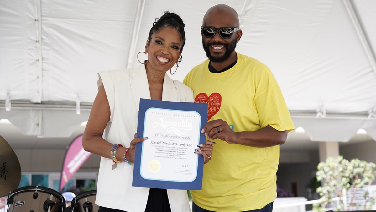 Assembly member, Mike Gipson Awards Areva a certificate of recognition for providing meaningful resources to students