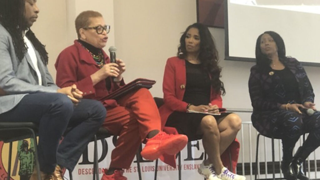 a panel of experts speaks at the Busch Center of St. Louis University about the amount of wealth owed to the slaves who built the University